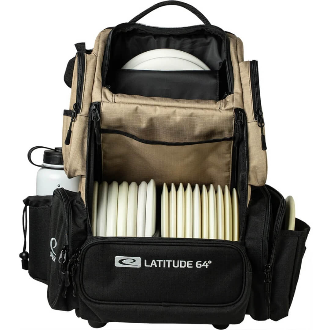 Latitude 64 DG Luxury E5 backpack in Sand/Black outdoors, open and loaded with discs